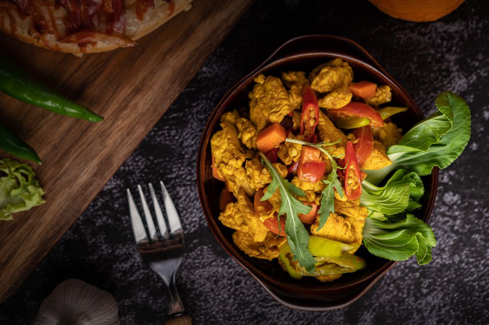 Chicken stirfry with rice,noodles, choy sum, bok choy, brocolli, tomato and carrot
